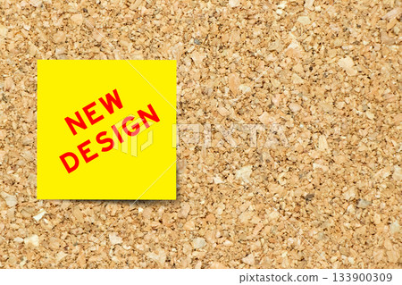 Yellow note paper with word new design on cork board background with copy space Yellow note paper with word new design on cork board background with copy space 133900309