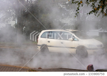 Scene depicts stranded delivery driver amid thick vapors and autumnal urban environment 133900750