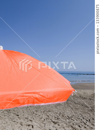Part of orange beach umbrella Part of orange beach umbrella 133900875