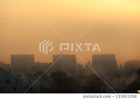 City skyline with three tall buildings and a hazy, smoggy atmosphere City skyline with three tall buildings and a hazy, smoggy atmosphere 133901098