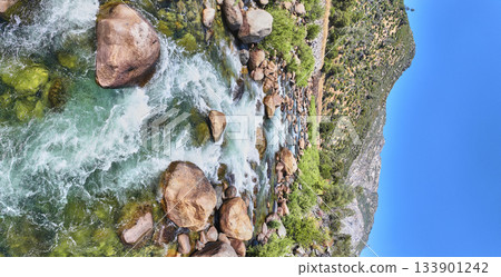 Aerial Merced River Flowing Over Rocks and Lush Green Hills Panorama 133901242