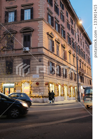 Rome evening street cafe and piazza with outdoor seating food stand and crowd nightlife. High quality photo 133901415