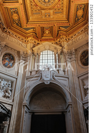 Archbasilica of Saint John Lateran Rome exterior facade and grand baroque interior with golden coffered ceiling vast nave marble statues side chapels ornate altar apse and dome Catholic basilica 133901452