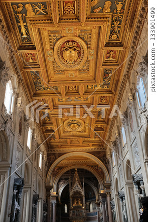 Archbasilica of Saint John Lateran Rome exterior facade and grand baroque interior with golden coffered ceiling vast nave marble statues side chapels ornate altar apse and dome Catholic basilica 133901499