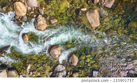 Aerial Merced River Flowing Over Rocks and Mossy Riverbed Top Down 133901737