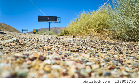 Ground Level Mojave Desert Roadside Gravel Shrubbery and Billboard California Ground Level Mojave Desert Roadside Gravel Shrubbery and Billboard California 133901750