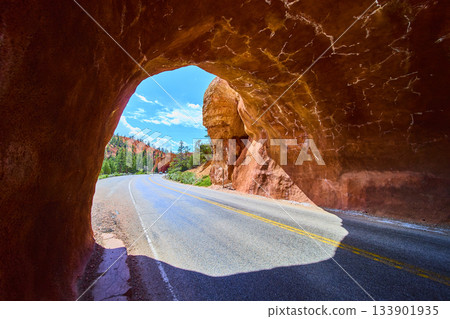 Red Rock Tunnel Scenic Road and Blue Sky in Red Canyon Utah 133901935