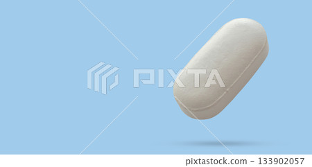White medicine pill tablet float on blue background White medicine pill tablet float on blue background 133902057