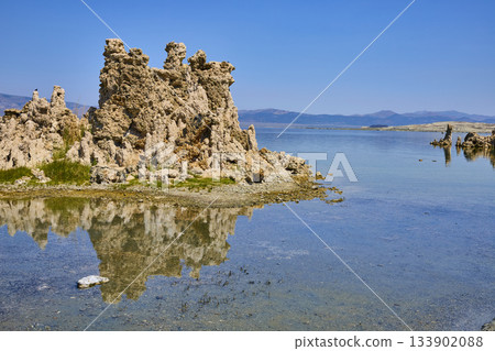 Mono Lake Tufa Formations Reflected in Clear Water with Mountain Landscape California 133902088