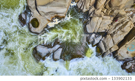 Aerial Turbulent River Cascades and Rocky Landscape Top Down Aerial Turbulent River Cascades and Rocky Landscape Top Down 133902133