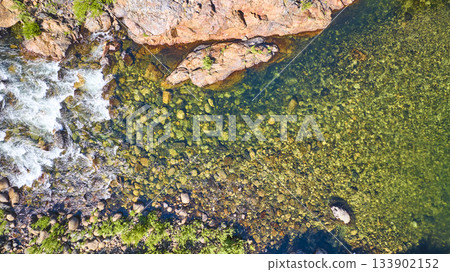 Aerial Merced River Clear Water Rocky Riverbank and Green Vegetation Top Down 133902152