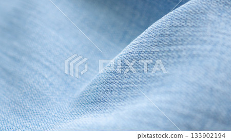 Old denim blue jeans fabric texture background close up 133902194