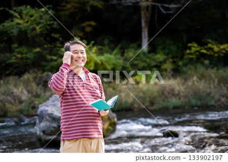 A man calling on a smartphone 133902197