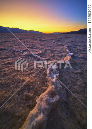 Salt Formations and Mountains at Golden Hour in Badwater Basin Death Valley Salt Formations and Mountains at Golden Hour in Badwater Basin Death Valley 133903062