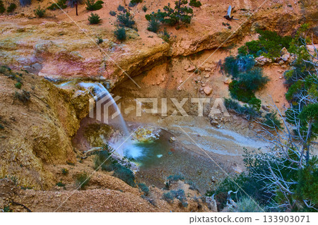 Waterfall and Red Rock Formations at Mossy Cave Trail in Bryce Canyon National Park Waterfall and Red Rock Formations at Mossy Cave Trail in Bryce Canyon National Park 133903071