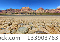 Ground Level Red Rock Canyon Mountains Roadside Cars and Desert Landscape 133903763