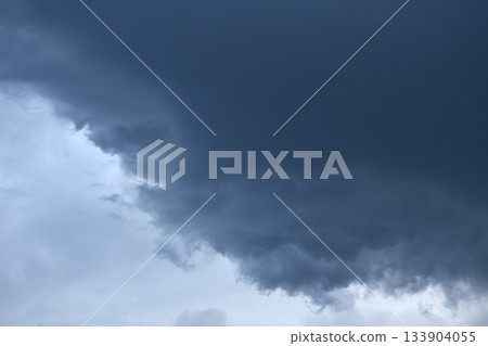 dark rain cloud floating on sky at sunset in evening 133904055