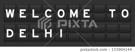 Black color analog flip board with word welcome to delhi on gray background Black color analog flip board with word welcome to delhi on gray background 133904144