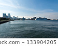 Asuka III and Diamond Princess moored side by side at Yokohama Osanbashi Pier, with the Yokohama Minato Mirai district visible in the background. 133904205