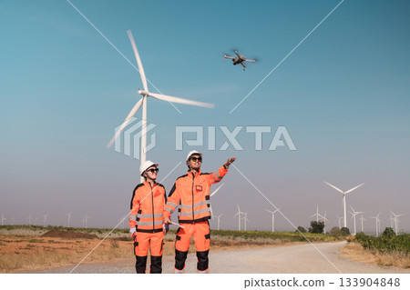 Engineers are inspecting wind turbines to generate electricity. Engineers are inspecting wind turbines to generate electricity. 133904848