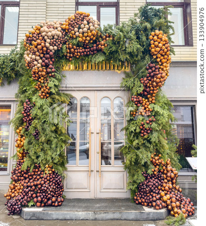 Holiday Shopfront With Cheerful Greenery, Vibrant Festive Archway Enhances Market Entrance Holiday Shopfront With Cheerful Greenery, Vibrant Festive Archway Enhances Market Entrance 133904976