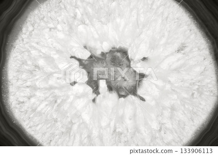 Amazing agate cut cross section. Natural crystal mineral formation. Beautiful texture macro photo background of precious stone color of 2026 year cloud white 133906113