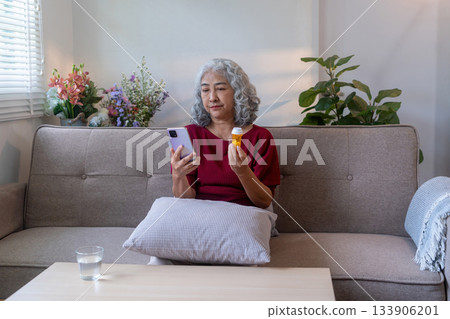 Elderly Woman Searching for Medicine Detail 133906201