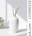 white vase with plant on white background 133906558