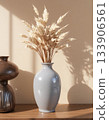 still life with vase and flower on wooden table 133906561
