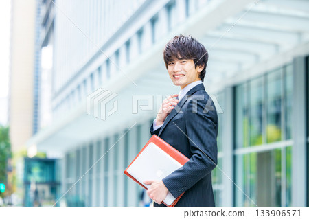 young man wearing a suit 133906571