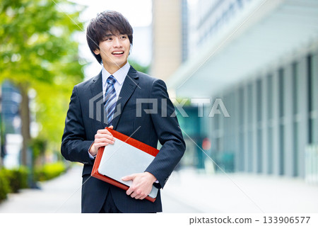 young man wearing a suit 133906577