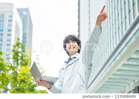 A young man wearing work clothes A young man wearing work clothes 133906609