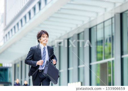 Running businessman 133906659