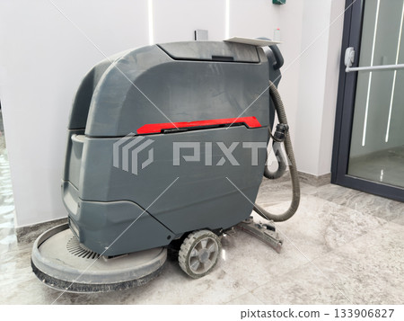 Cleaning unit with brushes under professional equipment. Electric cleaning cart for cleaning floors in public building. Cleaning shopping center with industrial vacuum cleaner with brushes Cleaning unit with brushes under professional equipment. Electric cleaning cart for cleaning floors in public building. Cleaning shopping center with industrial vacuum cleaner with brushes 133906827