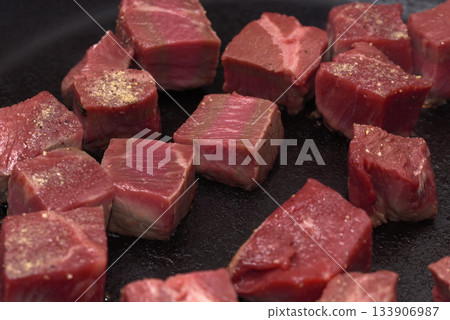Meat cooked on a frying pan, diced steak Meat cooked on a frying pan, diced steak 133906987
