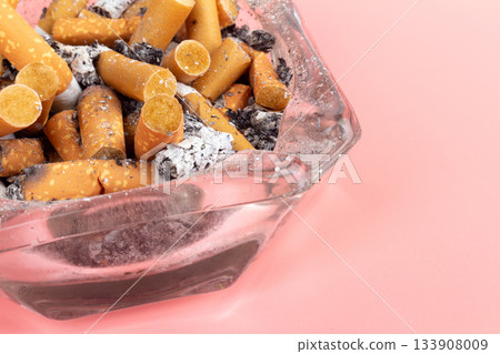 cigarette butts torn on pink background ashtray cigarette butts torn on pink background ashtray 133908009