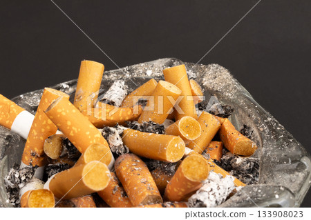 cigarette butts torn on black background ashtray cigarette butts torn on black background ashtray 133908023