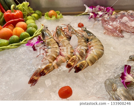fresh large shrimps are placed on ice for cooking fresh large shrimps are placed on ice for cooking 133908246