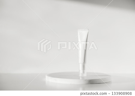 Blank cream tube on marble background color of 2026 year cloud white Blank cream tube on marble background color of 2026 year cloud white 133908908