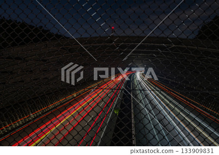 A view of the Shin-Tomei Expressway through a fence in Hamamatsu City (Shizuoka Prefecture) A view of the Shin-Tomei Expressway through a fence in Hamamatsu City (Shizuoka Prefecture) 133909831