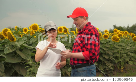 Agriculture, teamwork, business partner farmer agriculture, handshake sign of deal, harvest, fresh soil grow crops, farmer working hand tablet, handshake sign of deal, development modern agriculture 133909846