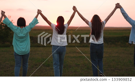 group people walking sunset holding hands, happy strong friendly family, child parents, father mother child boy girl, people united together, together facing future, sunset happiness background 133909852