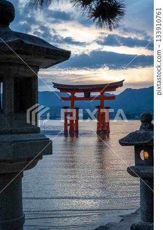 Torii of Itsukushima Shrine at sunset on Miyajima island Torii of Itsukushima Shrine at sunset on Miyajima island 133910761