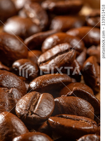 Close-up macro photograph of dark roasted coffee beans on texture background Close-up macro photograph of dark roasted coffee beans on texture background 133911418