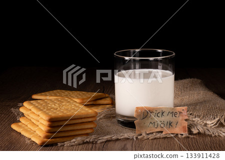 A classic pairing of milk and crackers displayed on a kitchen table setting A classic pairing of milk and crackers displayed on a kitchen table setting 133911428