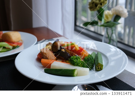 Green okra food on a plate, organic seasonal vegetable kitchen cooking 133911471