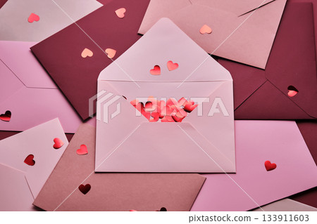 Envelopes spreading love with heart confetti 133911603