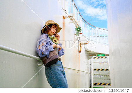 Summer travelers relaxing on the ferry deck 133911647