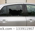 Car break-in with shattered smashed side window. Economic downturn fuels street criminality, shattered vehicle glass signaling hardship and criminality rise. 133911907