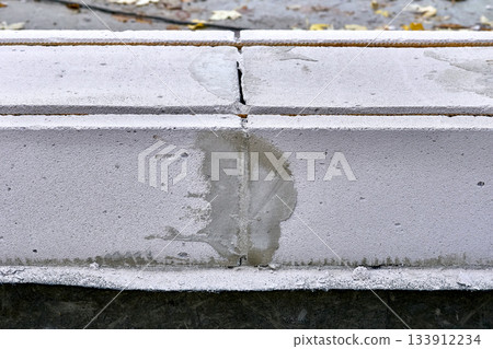 Construction joint between two concrete blocks, sealed with cement Construction joint between two concrete blocks, sealed with cement 133912234